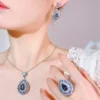 Female model wearing full baroque simulated sapphire 3 piece jewelry set earrings necklace ring real lifestyle wearing photo