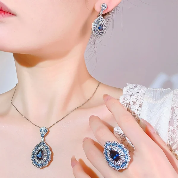Female model wearing full baroque simulated sapphire 3 piece jewelry set earrings necklace ring real lifestyle wearing photo