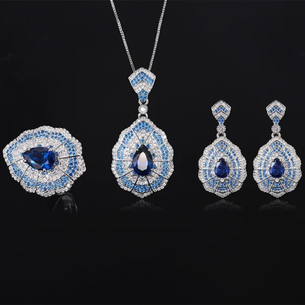 Whole collection baroque fan teardrop simulated sapphire 3 piece jewelry set earrings necklace ring flat lay black background