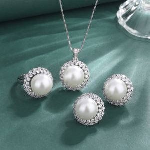 Whole collection double halo cubic zirconia pearl 3 piece jewelry set earrings necklace ring flat lay product photo