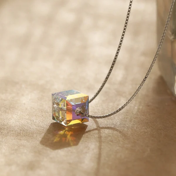 Side view studio photo S925 silver aurora cube pendant necklace, showing three-dimensional cube structure and rainbow light reflection effect