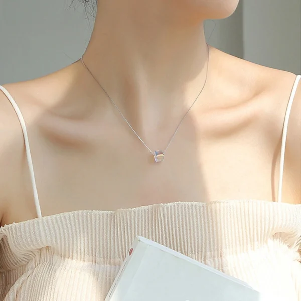 Lifestyle photo of woman wearing S925 silver aurora cube choker necklace, showing actual neck fit effect and minimalist elegant daily matching effect