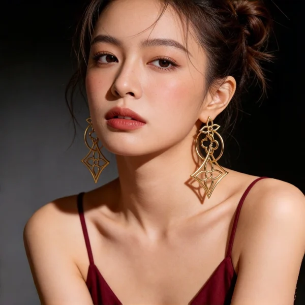 Female model bilateral wearing pair hollow four leaf clover long drop gold earrings full upper body shot