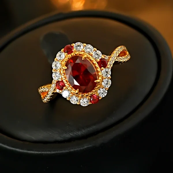 Twisted split shank adjustable ring with oval simulated ruby halo placed inside red lined jewelry box close up photo