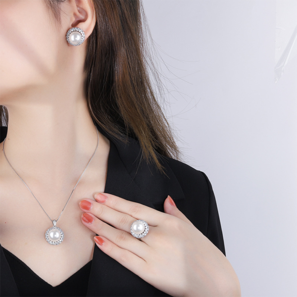 Female model wearing full double halo pearl 3 piece jewelry set earrings necklace ring real wearing lifestyle photo