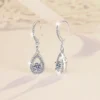 Dual angle front & back view shot of S925 silver moissanite teardrop earrings, showing front pave design, hollow back frame, stone setting and structural thickness detail