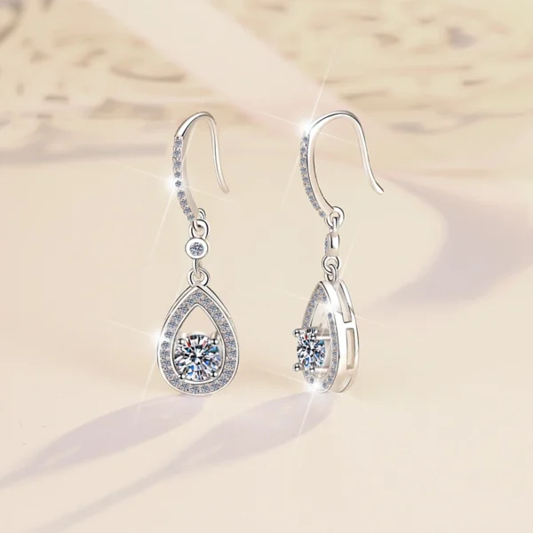 Dual angle front & back view shot of S925 silver moissanite teardrop earrings, showing front pave design, hollow back frame, stone setting and structural thickness detail