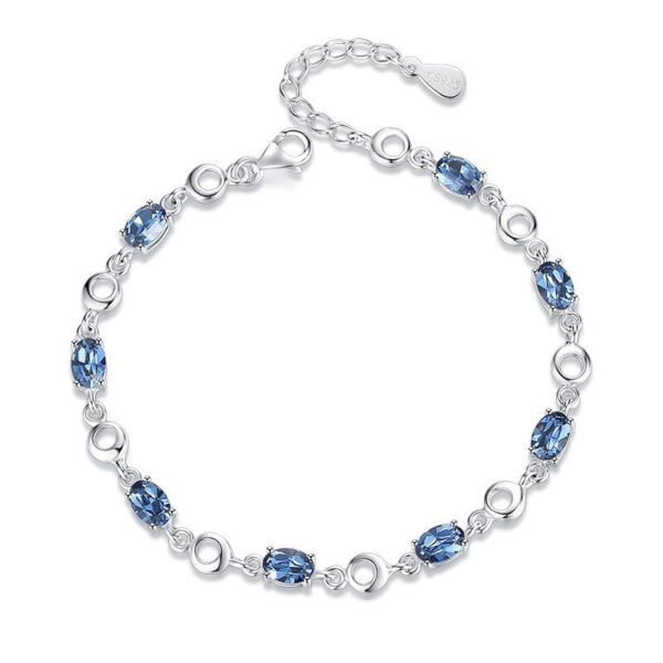 Silver plated ocean heart blue crystal bracelet on pure white background, adjustable women’s jewelry