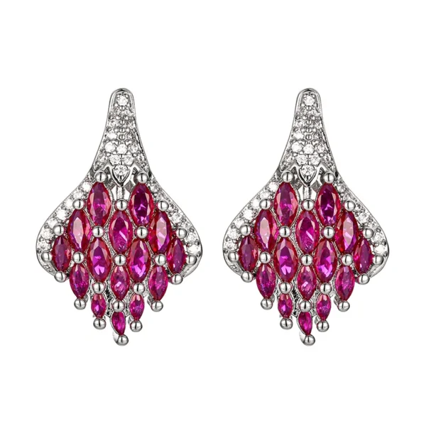 Matching pair pave simulated ruby phoenix tail teardrop drop earrings isolated white background