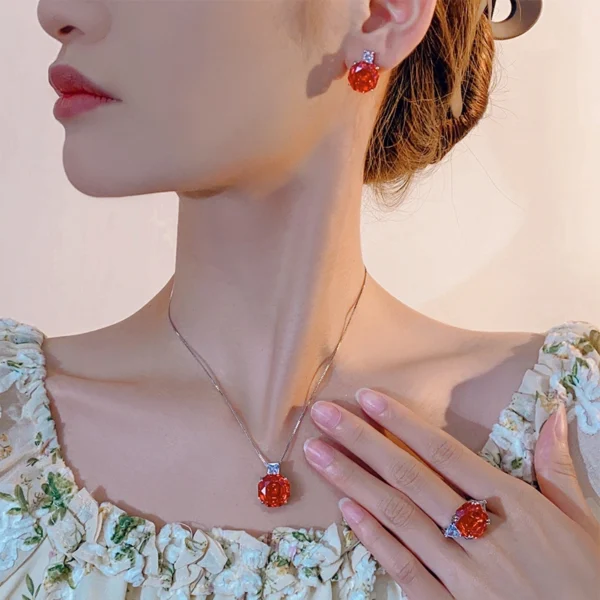 Female model wearing rose cut orange cubic zirconia 3 piece jewelry set earrings necklace ring