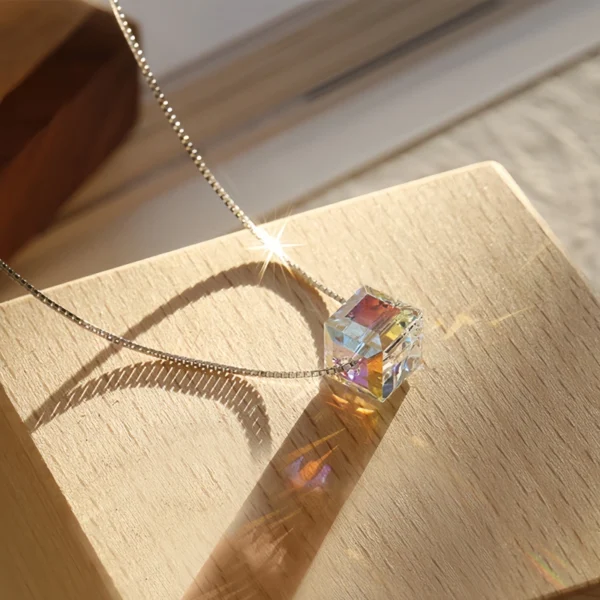 Aesthetic flat lay photo S925 silver aurora cube crystal choker necklace placed on wooden block, bright iridescent crystal under natural light