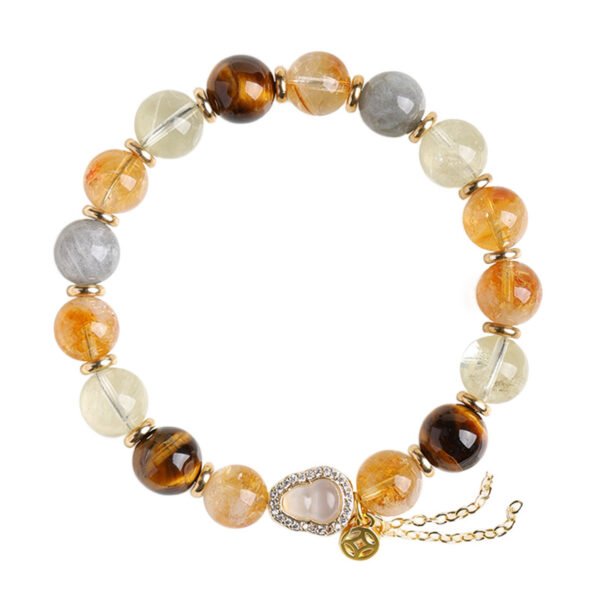 Main product shot of yellow rutilated quartz wealth bracelet on pure white background with adjustable gourd charm